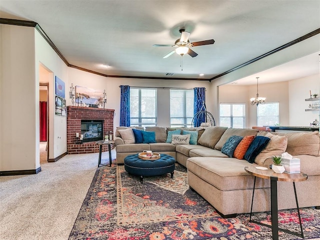 13512 SE 95th St, Oklahoma City, OK 73165 - carpeted living area with crown molding, a ceiling fan, a chandelier, and a brick fireplace