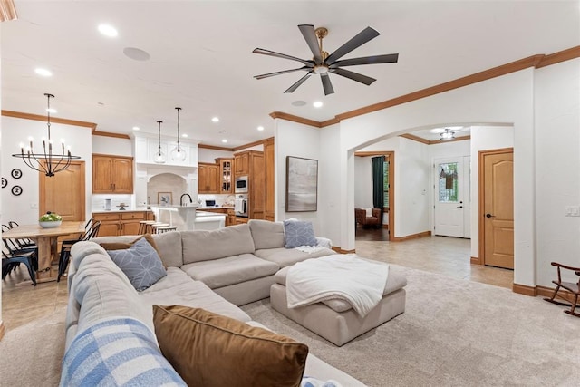 1900 Cobblestone Dr, Shawnee, OK 74804 - living area with arched walkways, ceiling fan, a chandelier, recessed lighting, and ornamental molding
