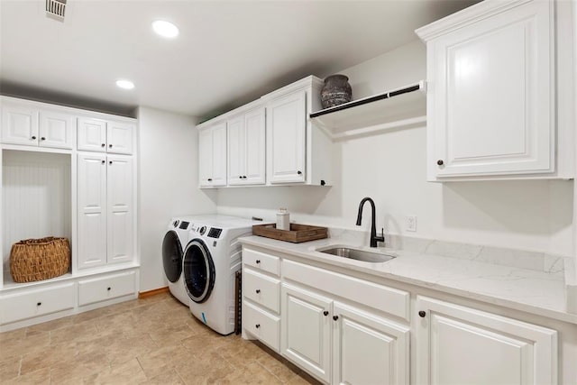 1900 Cobblestone Dr, Shawnee, OK 74804 - washroom featuring washing machine and clothes dryer, cabinet space, and recessed lighting