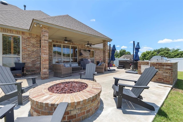 1900 Cobblestone Dr, Shawnee, OK 74804 - view of patio / terrace featuring an outdoor living space with a fire pit, a ceiling fan, an outdoor kitchen, and a hot tub