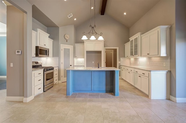 2329 Chase Way, Yukon, OK 73099 - kitchen with appliances with stainless steel finishes, beamed ceiling, high vaulted ceiling, decorative backsplash, and glass insert cabinets