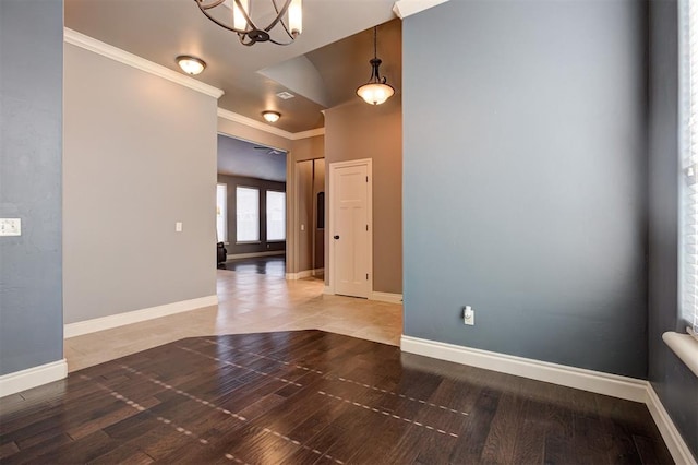 2329 Chase Way, Yukon, OK 73099 - spare room featuring ornamental molding and a chandelier
