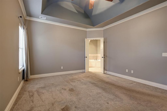 2329 Chase Way, Yukon, OK 73099 - empty room featuring carpet flooring, a ceiling fan, ornamental molding, a tray ceiling, and vaulted ceiling