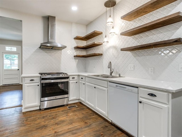 529 S 2nd Ave, Purcell, OK 73080 - kitchen with stainless steel range, wall chimney range hood, white dishwasher, open shelves, and backsplash