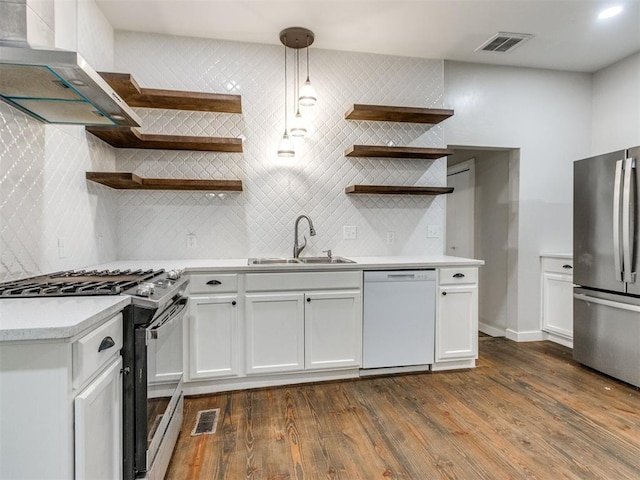 529 S 2nd Ave, Purcell, OK 73080 - kitchen with dishwasher, freestanding refrigerator, open shelves, and gas range