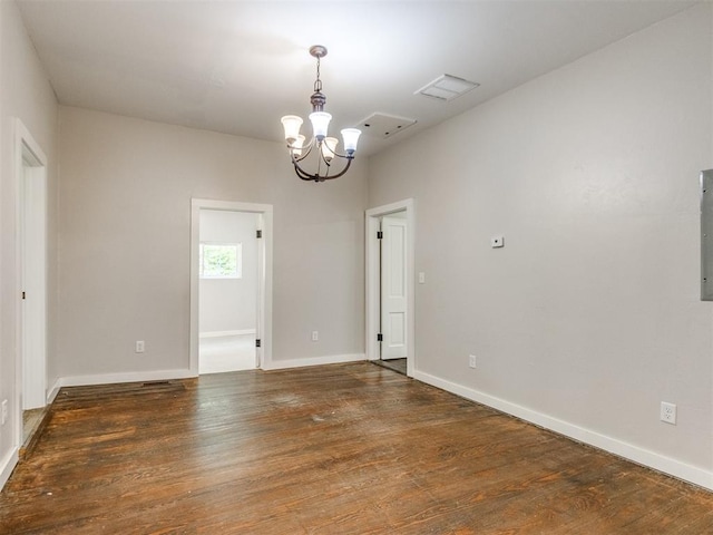 529 S 2nd Ave, Purcell, OK 73080 - spare room with a chandelier and wood finished floors