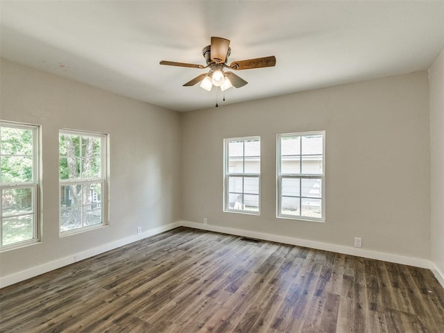 529 S 2nd Ave, Purcell, OK 73080 - spare room with dark wood-style flooring and a ceiling fan