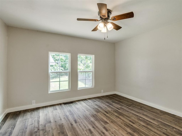 529 S 2nd Ave, Purcell, OK 73080 - empty room with dark wood-style flooring and a ceiling fan
