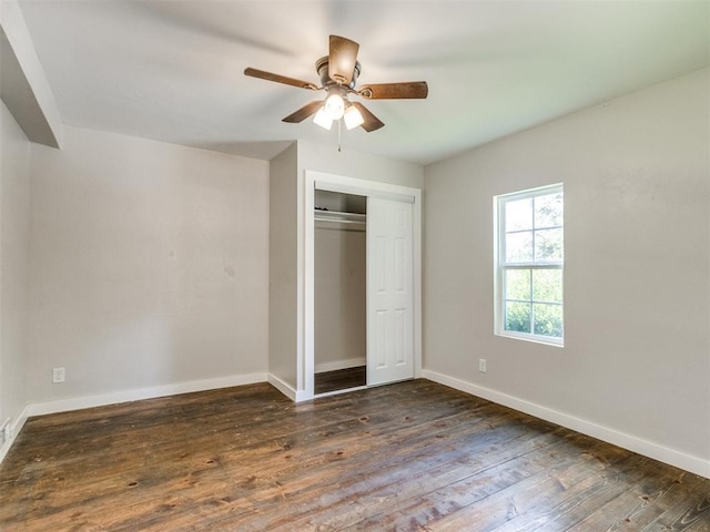 529 S 2nd Ave, Purcell, OK 73080 - unfurnished bedroom featuring dark wood-type flooring, a closet, and a ceiling fan