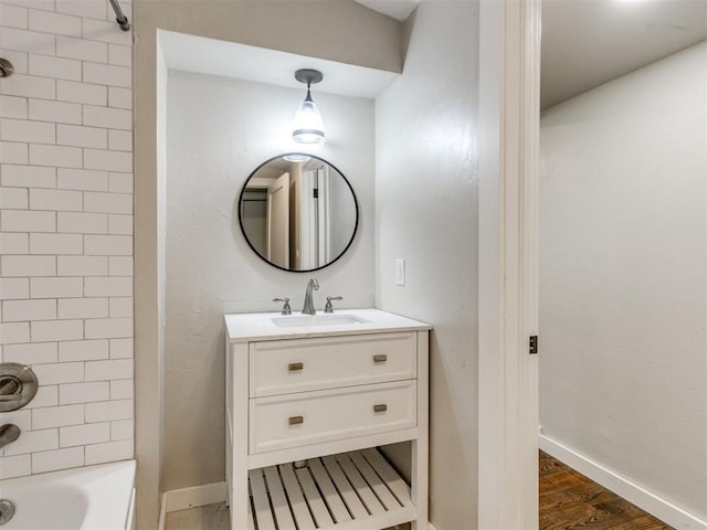 529 S 2nd Ave, Purcell, OK 73080 - bathroom featuring vanity, shower / washtub combination, and wood finished floors