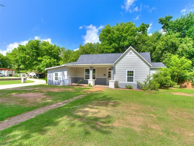 529 S 2nd Ave, Purcell, OK 73080 - ranch-style house featuring a front yard, covered porch, and a shingled roof