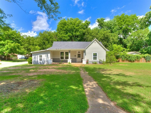 529 S 2nd Ave, Purcell, OK 73080 - ranch-style home featuring a porch, a front yard, and roof with shingles