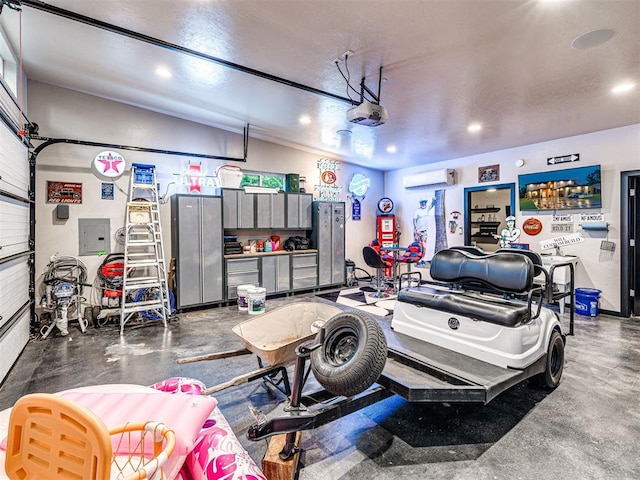 2824 Guilford Ln, Oklahoma City, OK 73120 - garage with electric panel, a wall mounted air conditioner, recessed lighting, and a garage door opener