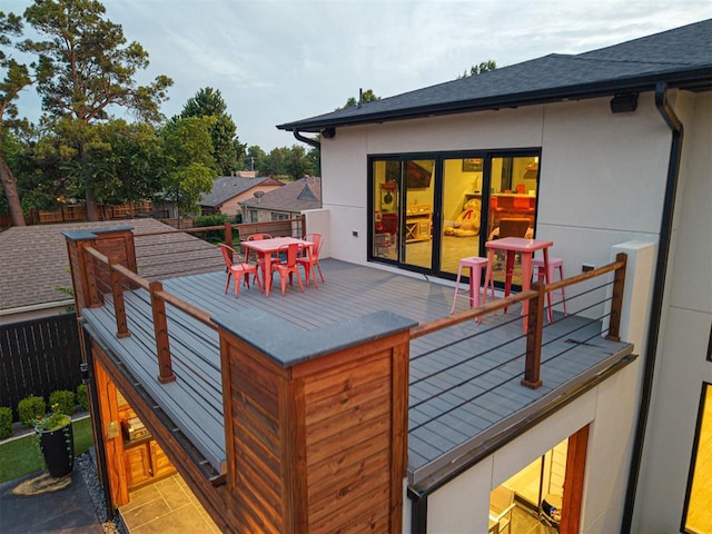 2824 Guilford Ln, Oklahoma City, OK 73120 - wooden terrace with outdoor dining area