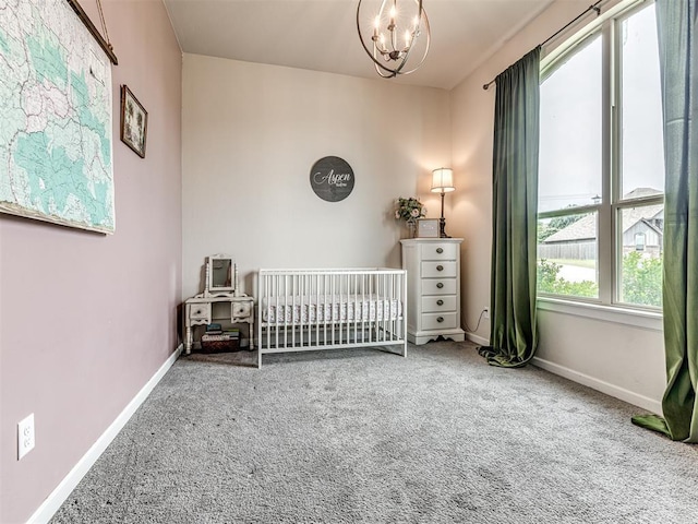 11104 Fairways Ave, Yukon, OK 73099 - carpeted bedroom featuring a chandelier and a crib