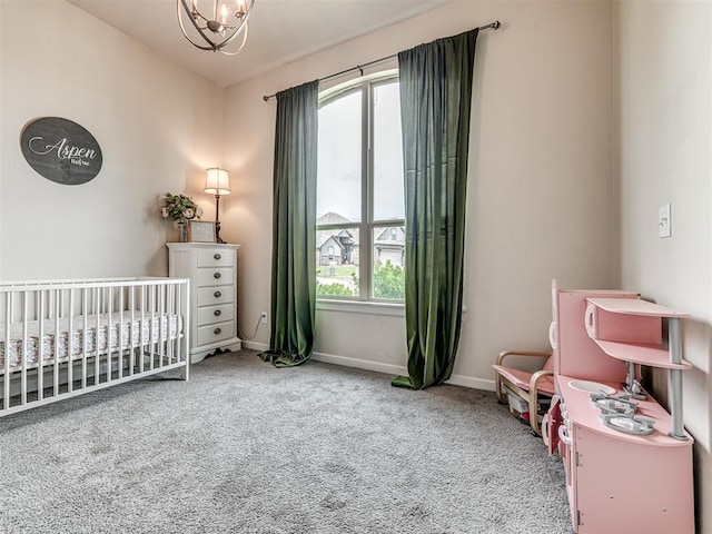 11104 Fairways Ave, Yukon, OK 73099 - bedroom featuring carpet floors, a crib, and a chandelier