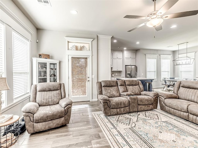 11104 Fairways Ave, Yukon, OK 73099 - living room featuring recessed lighting, light wood-style floors, and a ceiling fan