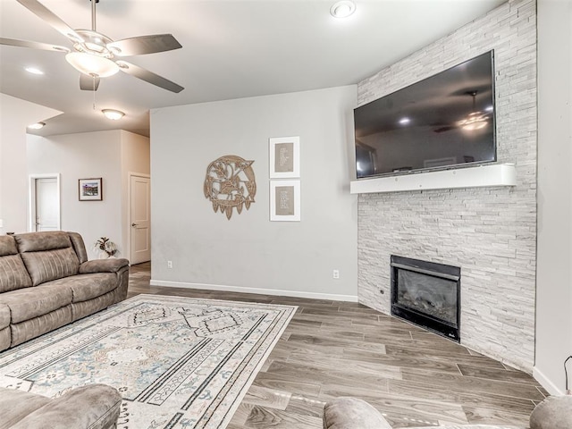 11104 Fairways Ave, Yukon, OK 73099 - living area featuring ceiling fan, wood finished floors, and a fireplace