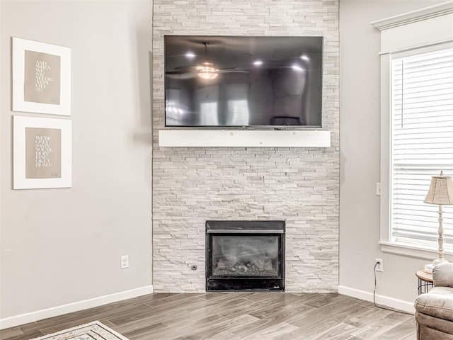 11104 Fairways Ave, Yukon, OK 73099 - detailed view of a fireplace and wood finished floors