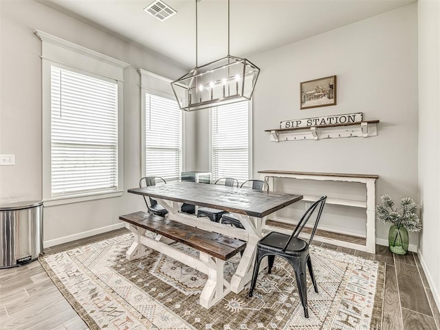 11104 Fairways Ave, Yukon, OK 73099 - dining area featuring a chandelier and light wood-style flooring