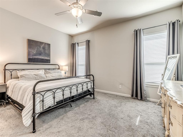 11104 Fairways Ave, Yukon, OK 73099 - bedroom featuring carpet floors, multiple windows, and ceiling fan