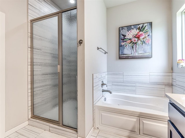 11104 Fairways Ave, Yukon, OK 73099 - bathroom with a stall shower, a garden tub, and vanity