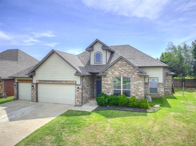 11104 Fairways Ave, Yukon, OK 73099 - view of front facade with a garage, a front lawn, driveway, brick siding, and a shingled roof
