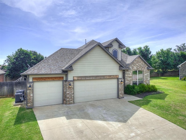 11104 Fairways Ave, Yukon, OK 73099 - traditional home featuring an attached garage, brick siding, concrete driveway, and roof with shingles