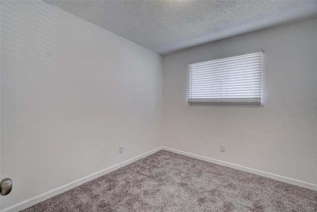 1409 Mcdonald Dr, Midwest City, OK 73130 - carpeted spare room featuring a textured ceiling