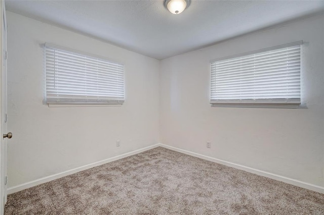 1409 Mcdonald Dr, Midwest City, OK 73130 - carpeted spare room featuring baseboards