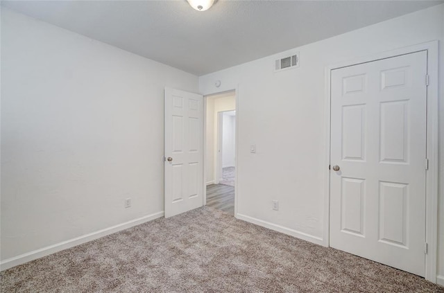 1409 Mcdonald Dr, Midwest City, OK 73130 - unfurnished bedroom with carpet and baseboards