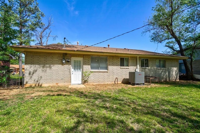 1409 Mcdonald Dr, Midwest City, OK 73130 - rear view of house featuring brick siding
