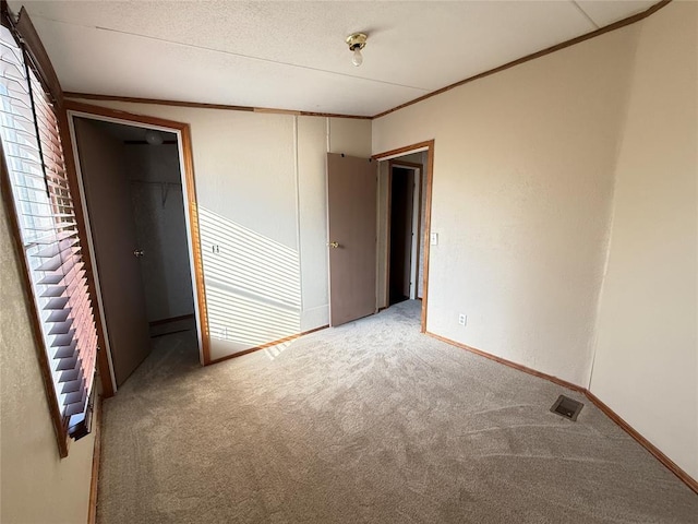 35440 Ew 1410th Rd, Konawa, OK 74849 - unfurnished bedroom featuring carpet and ornamental molding