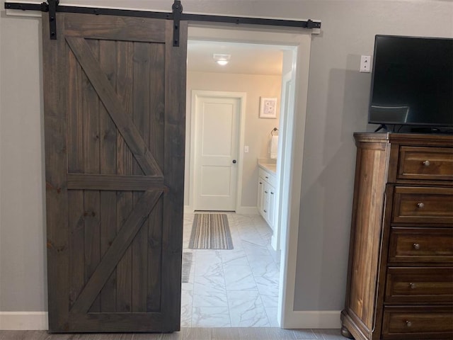 5557 Coker Rd, Shawnee, OK 74804 - hall with light marble finish floors and a barn door