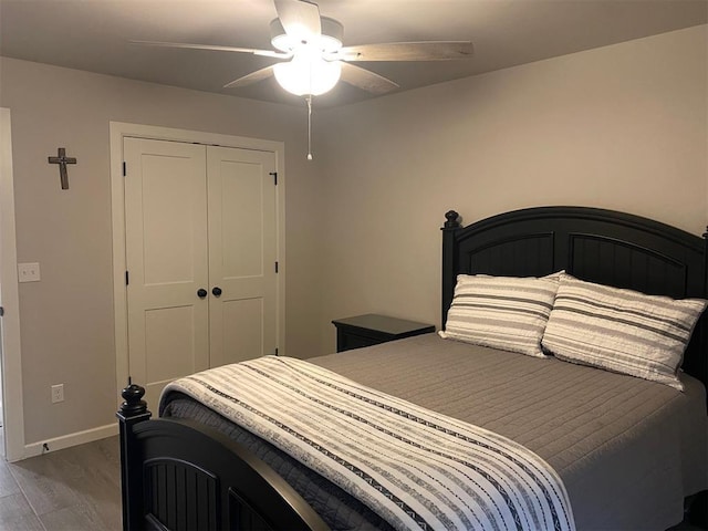 5557 Coker Rd, Shawnee, OK 74804 - bedroom featuring wood finished floors, a closet, and a ceiling fan