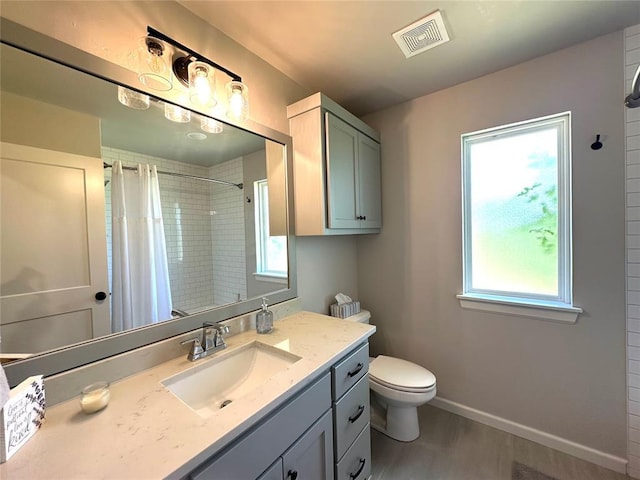 5557 Coker Rd, Shawnee, OK 74804 - bathroom featuring vanity, a shower with shower curtain, and wood finished floors