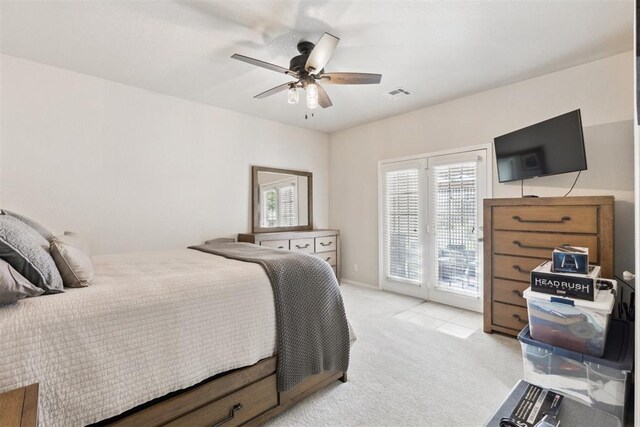 1800 NW 161st Pl, Edmond, OK 73013 - bedroom with access to outside, light carpet, and a ceiling fan