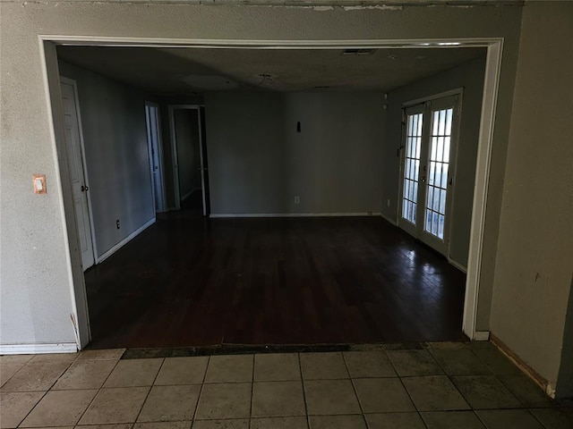 1137 Mallard Dr, Del City, OK 73115 - spare room with tile patterned flooring and a textured ceiling