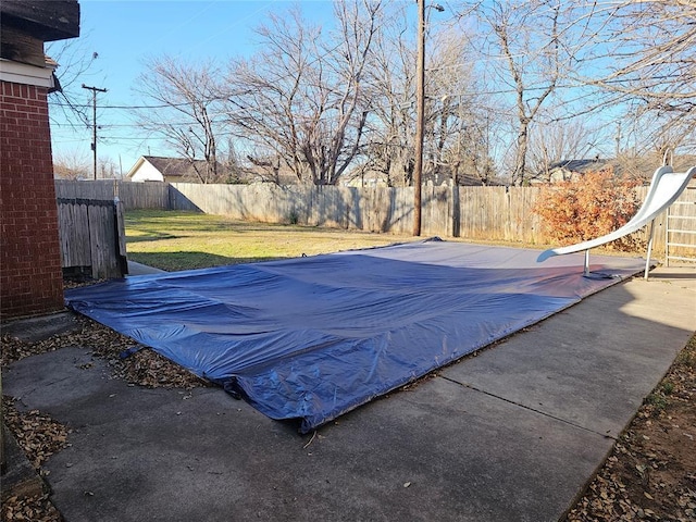 1137 Mallard Dr, Del City, OK 73115 - view of swimming pool featuring a fenced backyard and a patio area