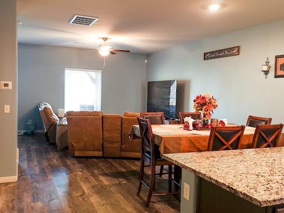 1016 NW 4th St, Newcastle, OK 73065 - dining room with dark wood-type flooring and a ceiling fan