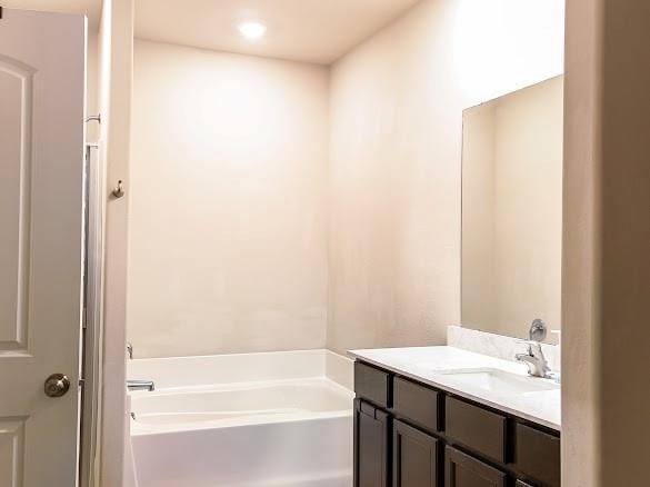 1016 NW 4th St, Newcastle, OK 73065 - full bath with a garden tub and vanity