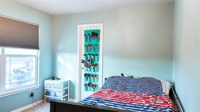 1016 NW 4th St, Newcastle, OK 73065 - bedroom featuring baseboards and carpet floors