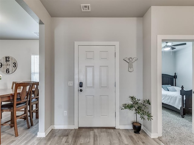14325 Meadow Ridge Ln, Edmond, OK 73025 - entrance foyer featuring wood finished floors and a ceiling fan