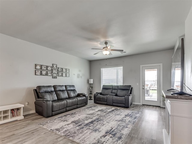 14325 Meadow Ridge Ln, Edmond, OK 73025 - living area with ceiling fan and light wood finished floors