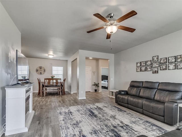 14325 Meadow Ridge Ln, Edmond, OK 73025 - living room with a ceiling fan and wood finished floors