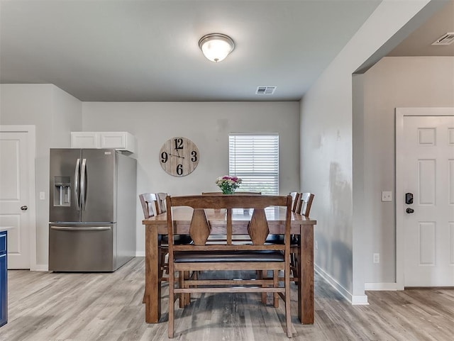 14325 Meadow Ridge Ln, Edmond, OK 73025 - dining area featuring light wood-type flooring