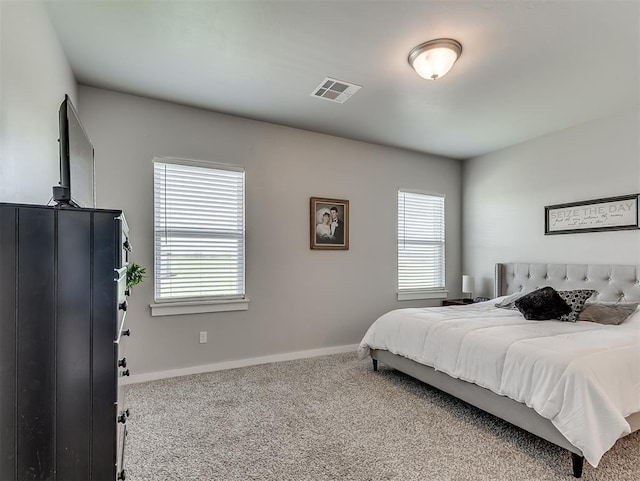14325 Meadow Ridge Ln, Edmond, OK 73025 - bedroom with carpet and multiple windows