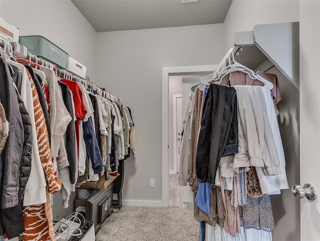 14325 Meadow Ridge Ln, Edmond, OK 73025 - spacious closet featuring carpet flooring