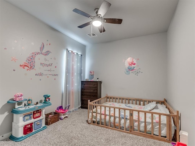14325 Meadow Ridge Ln, Edmond, OK 73025 - carpeted bedroom with a nursery area and a ceiling fan