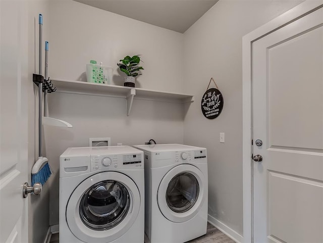 14325 Meadow Ridge Ln, Edmond, OK 73025 - laundry room featuring washing machine and dryer and wood finished floors